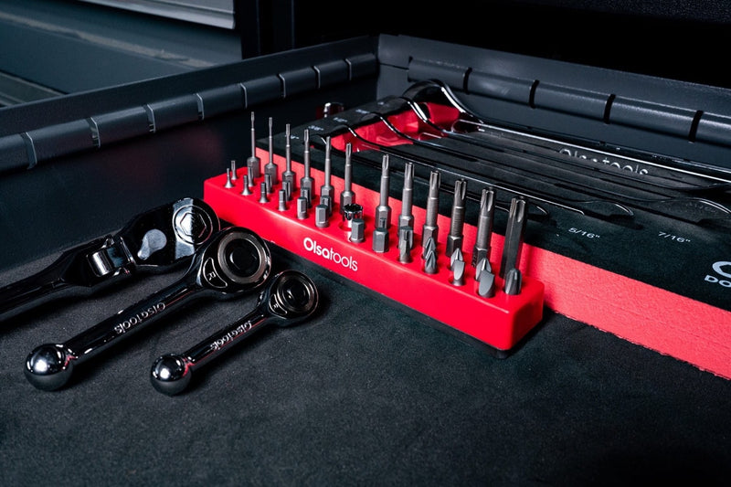 Red Olsa Tools quarter-inch hex bit holder organizing 32 hex bits with two gearless ratchets
