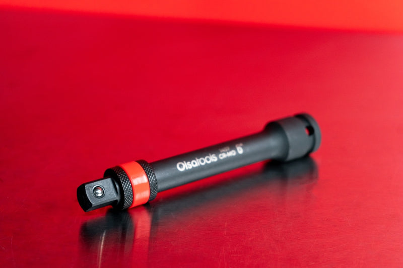 Closeup of the knurled grip on the spring-loaded locking mechanism of an impact socket extension