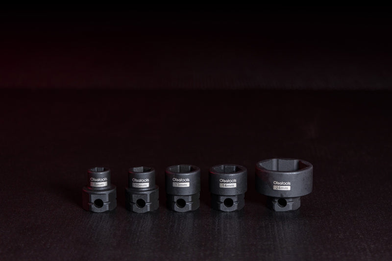 Stamped size markings on short stubby impact sockets.