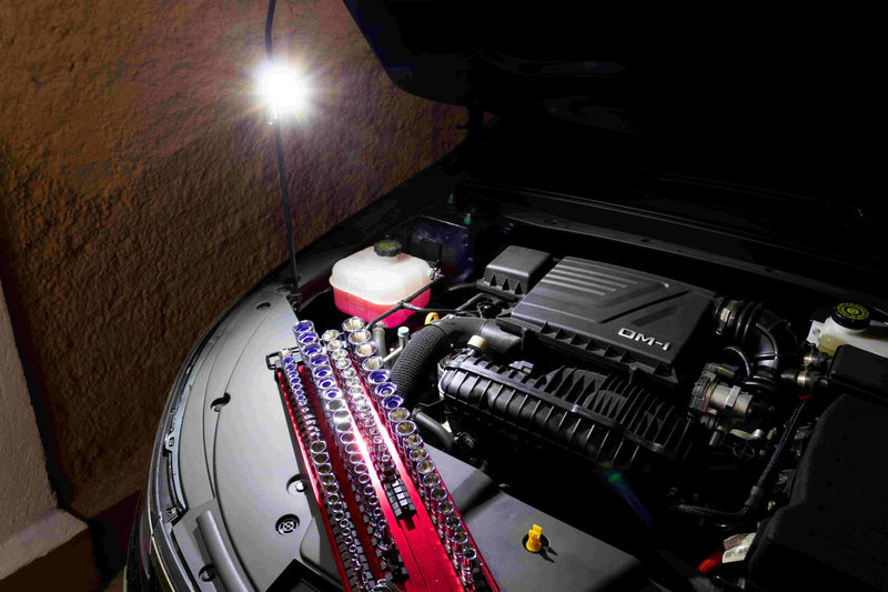 Mini LED work light lighting up an engine bay